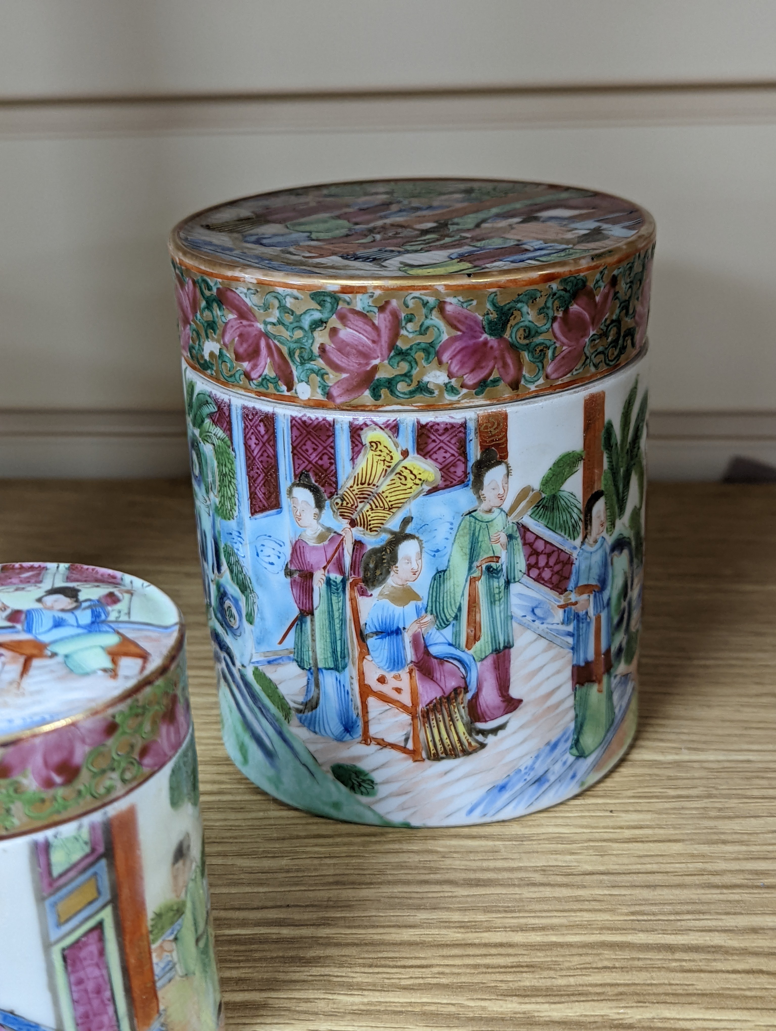 A Chinese Canton famille rose nest of boxes and covers, a similar candlestick and a tray 23cm